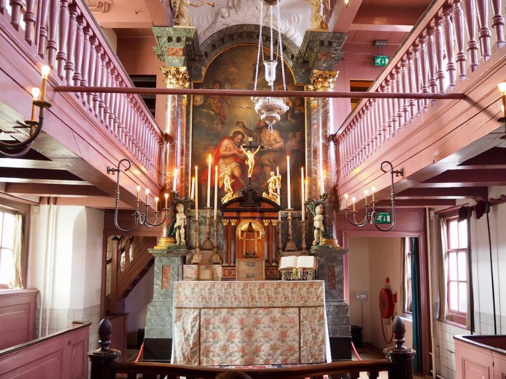 Visitors exploring a hidden church museum in Amsterdam
